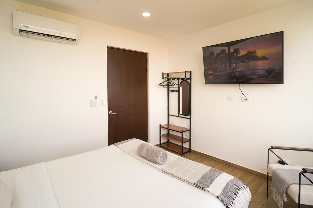 Bedroom with smart TV and AC